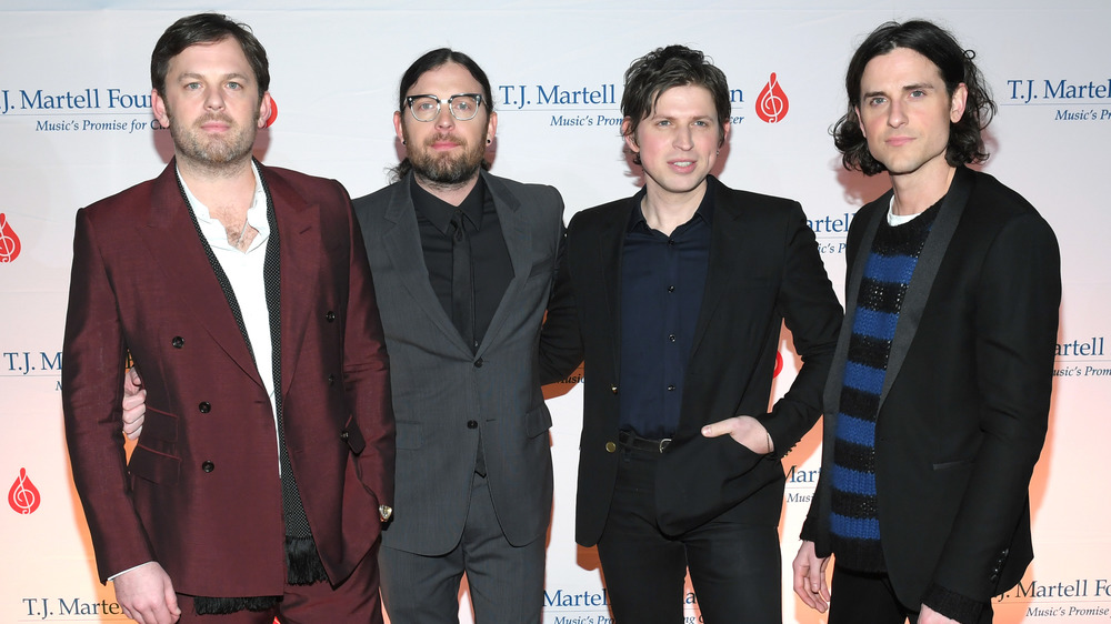 Rock band Kings of Leon posing on red carpet