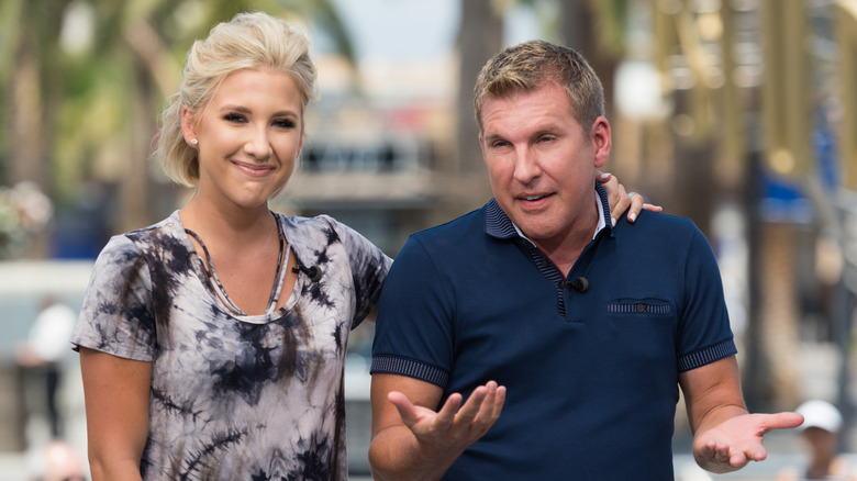 Savannah Chrisley with her arm around Todd Chrisley