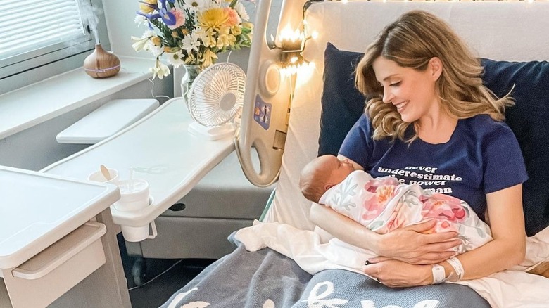 Jen Lilley holding her newborn baby