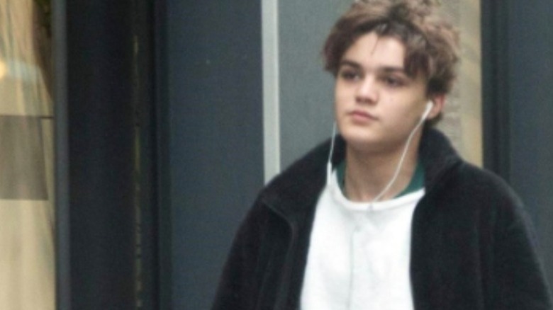 Jack Depp wearing headphones