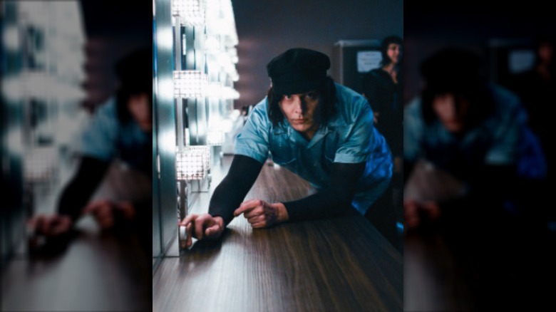 Jack White leaning on a counter