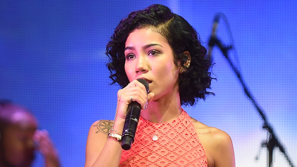 Jhené Aiko performing onstage