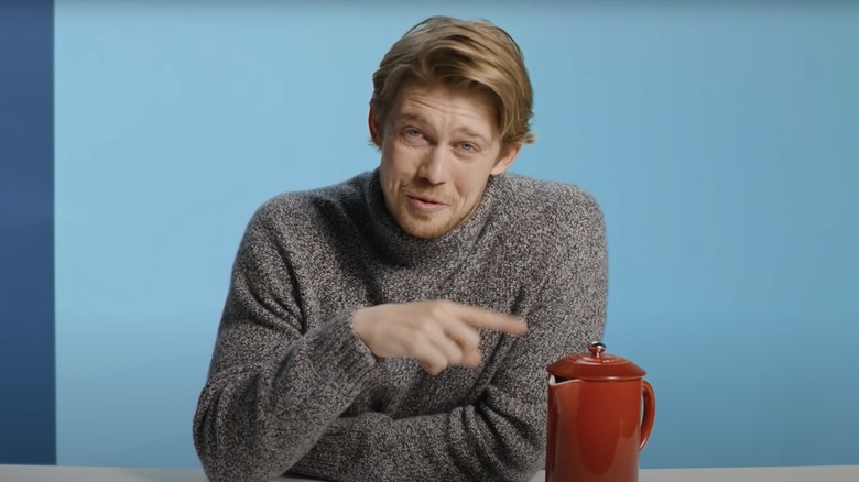 Joe Alwyn with a kettle