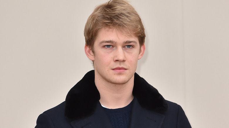 Joe Alwyn in a coat