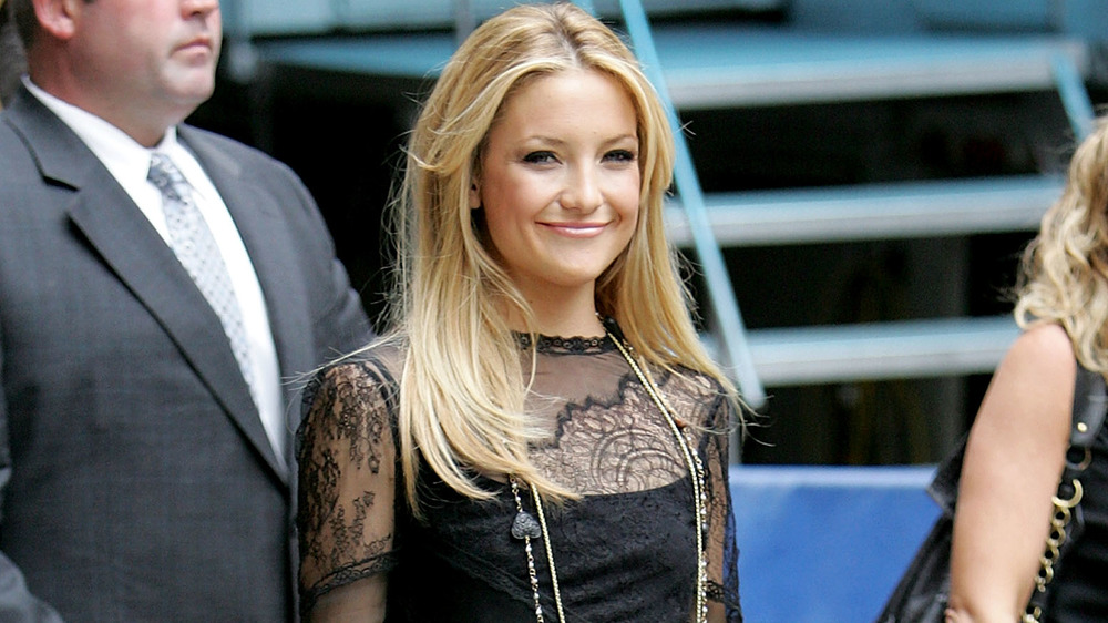 Kate Hudson smiling, outdoor event