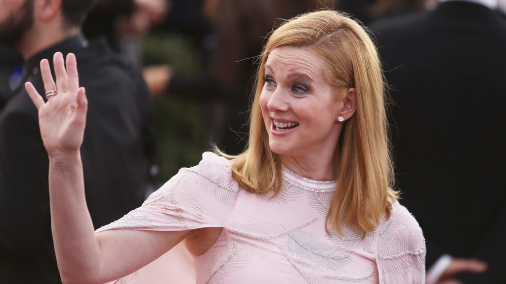 Laura Linney waving at red carpet event