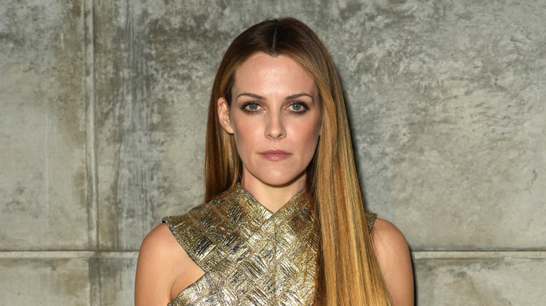 Riley Keough poses on the red carpet