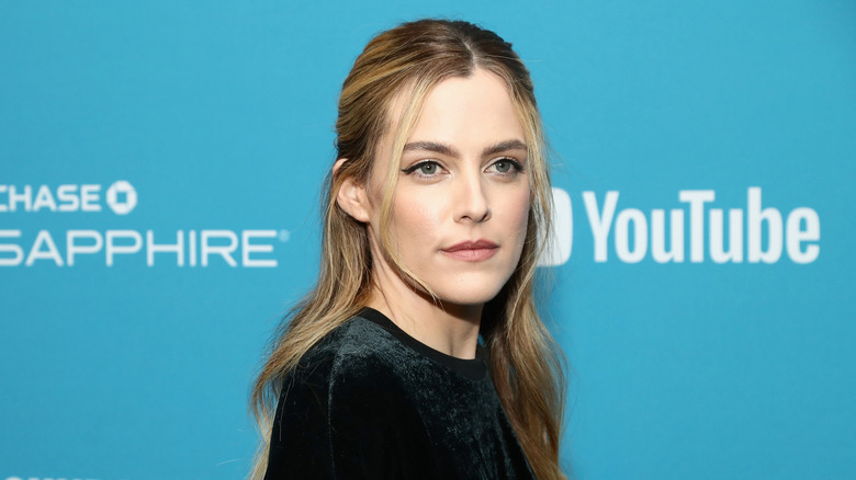 Riley Keough posing at event