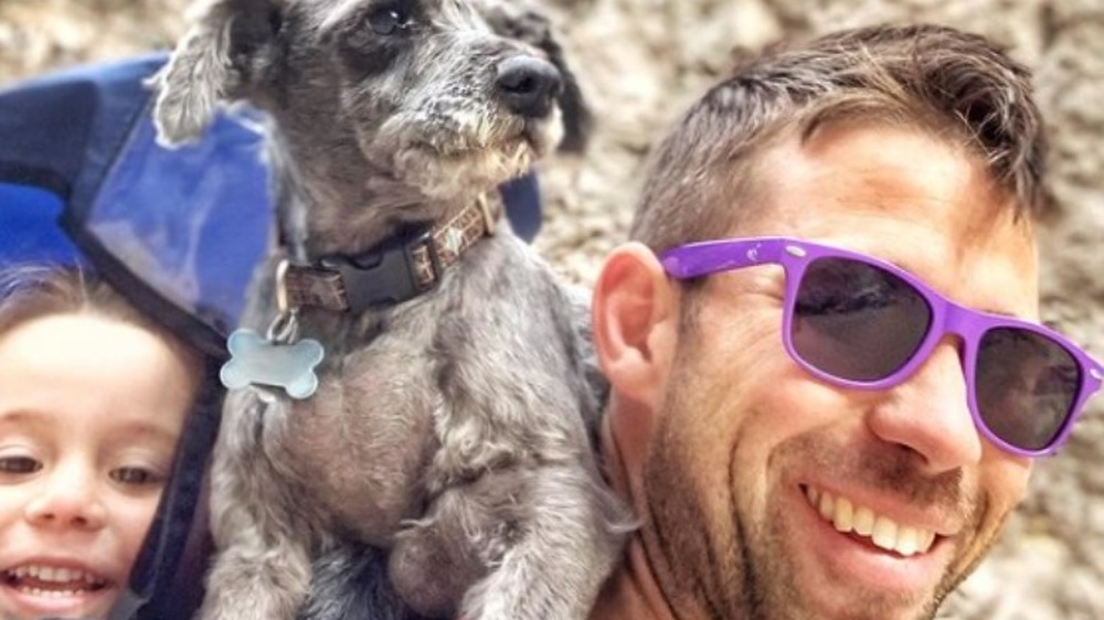 Dr. Cody Creelman hiking in purple sunglasses