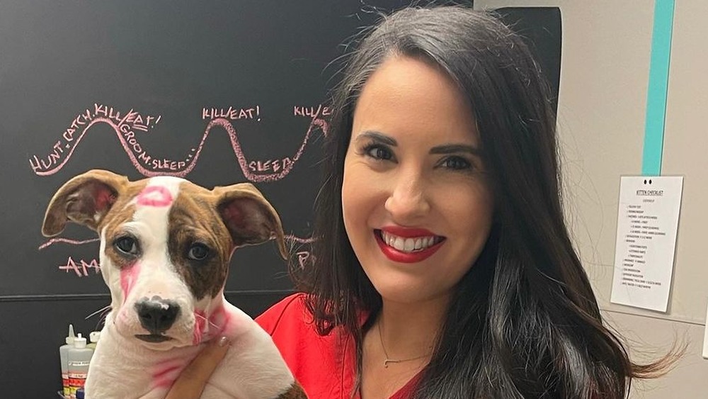 Jackie Duenas poses with a dog