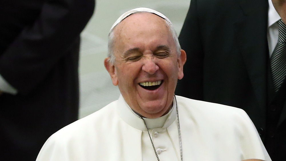 The pope laughing