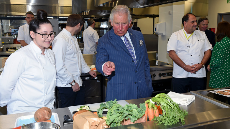 Prince Charles in a kitchen with chefs