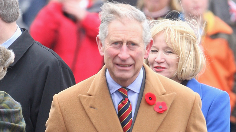 Prince Charles wearing a tan coat