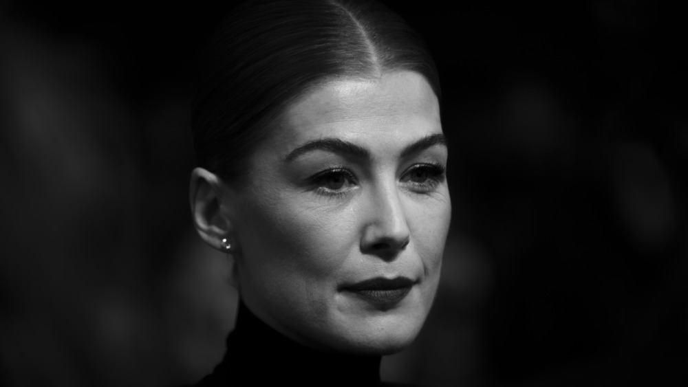 Actor Rosamund Pike looking serious in black and white photo