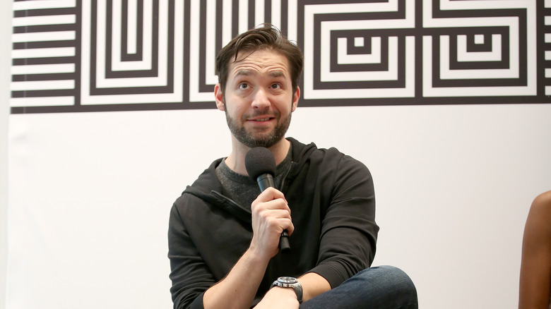 Alexis Ohanian speaks into microphone