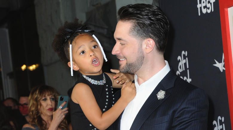 Alexis Ohanian holding his daughter