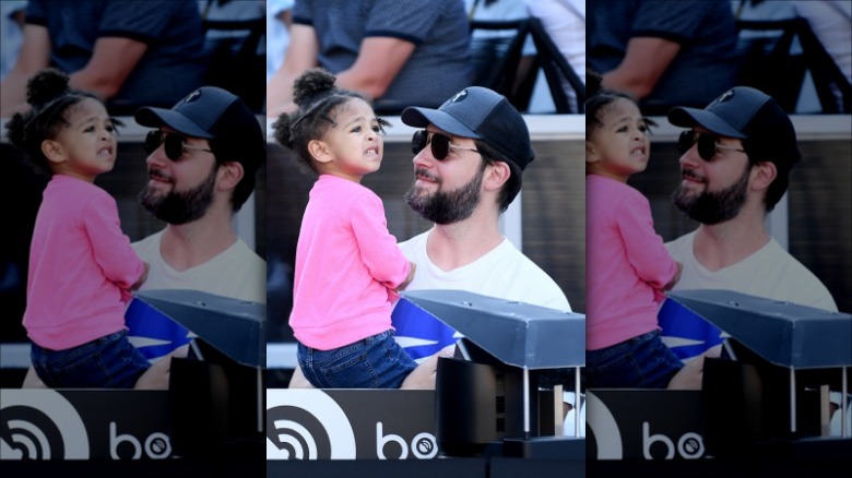 Alexis Ohanian holding his daughter