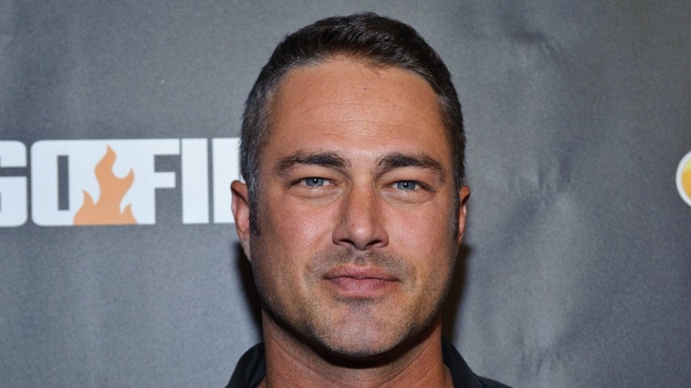 Taylor Kinney smirking