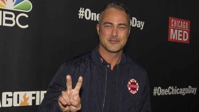 Taylor Kinney making peace sign