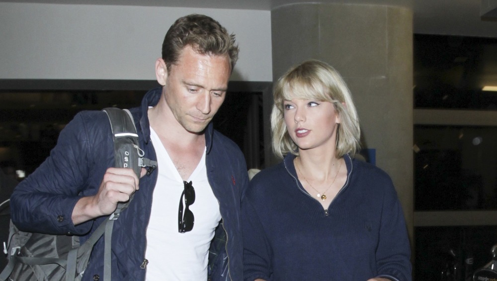 Taylor Swift and Tom Hiddleston walking together