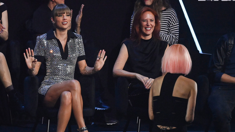 Tree Paine laughing with Taylor Swift