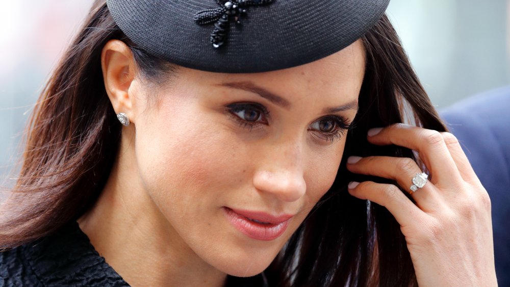 Meghan Markle wearing the royal family's jewelry