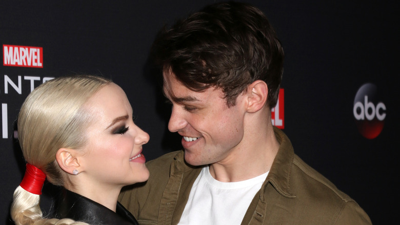 Dove Cameron and Thomas Doherty gazing at each other