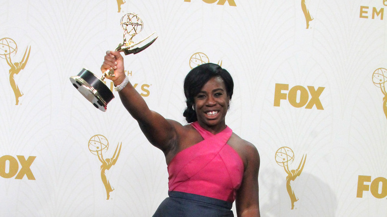 Uzo Aduba holding an Emmy