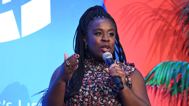 Uzo Aduba talking into a microphone