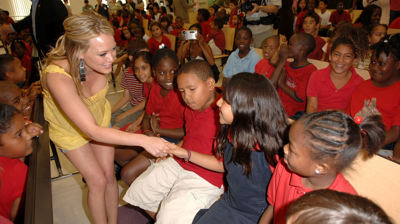 Hilary Duff charity blessings in a backpack