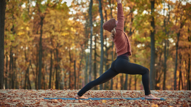 Doing yoga outdoors, autumn day