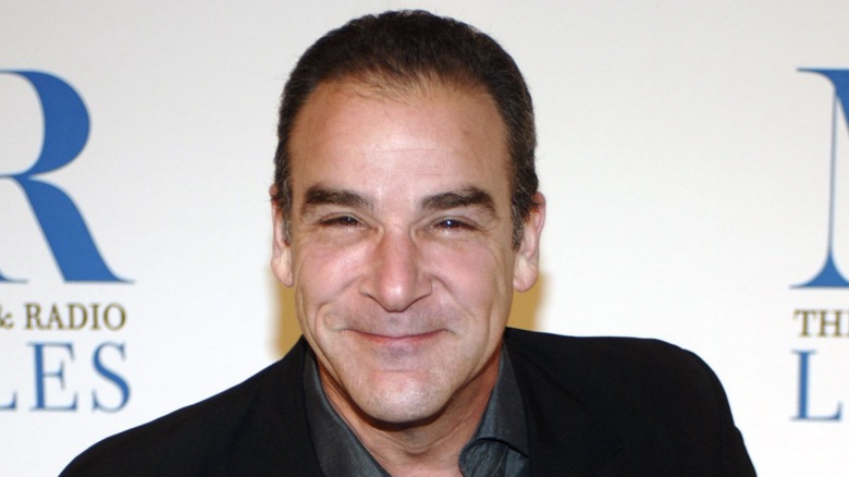 Mandy Patinkin squinting at the camera