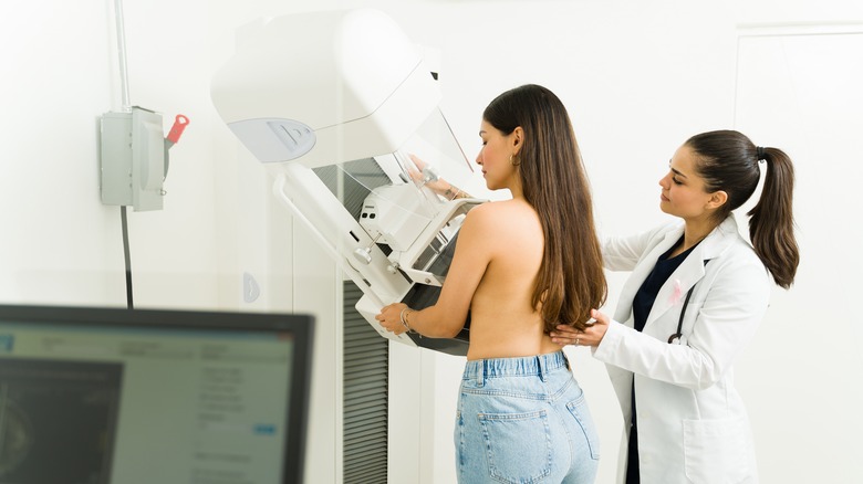 A woman getting a mammogram