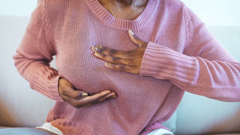 Woman inspecting her breast