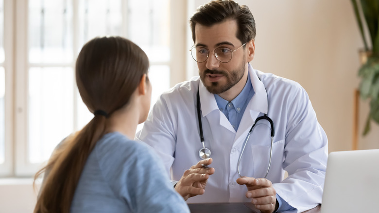 A woman speaking to her doctor