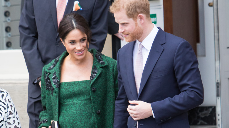 Meghan Markle and Prince Harry receive flowers after leaving Canada House