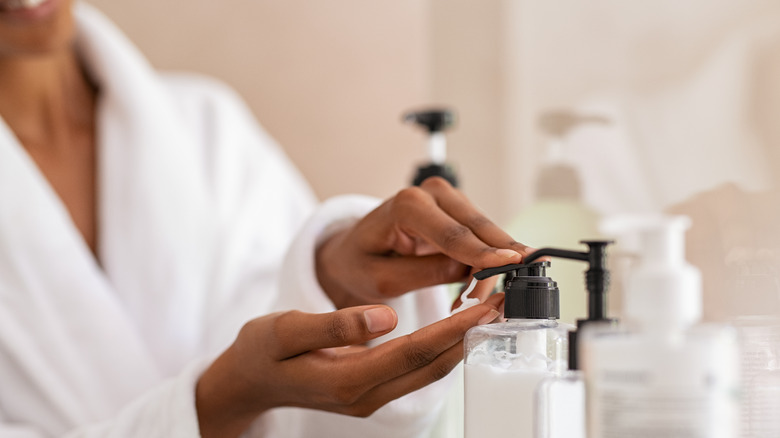 A woman using lotion 