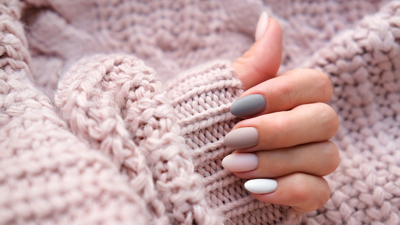 manicured nails with chunky sweater