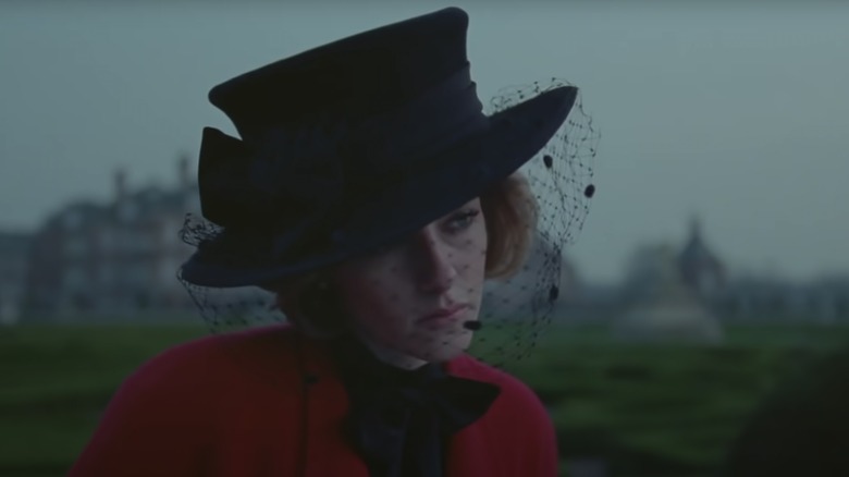 Kristen Stewart as Diana in a black hat