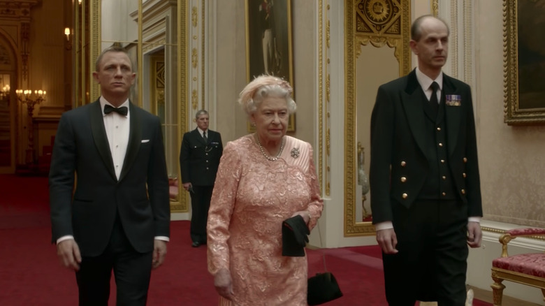 Daniel Craig, Queen Elizabeth II, and Paul Whybrew