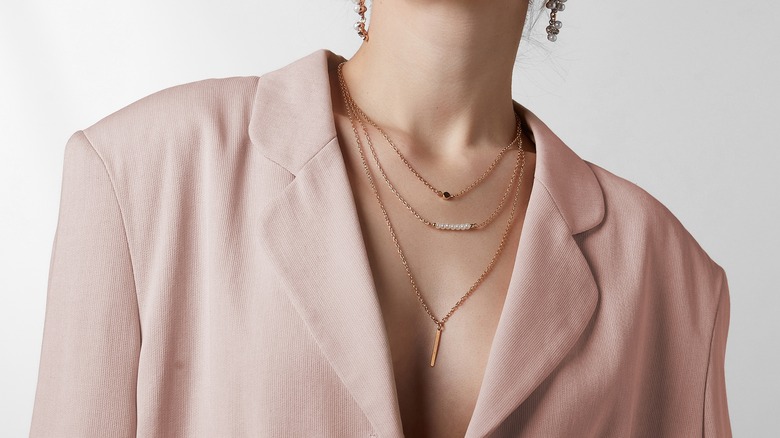 Woman wearing dainty necklaces