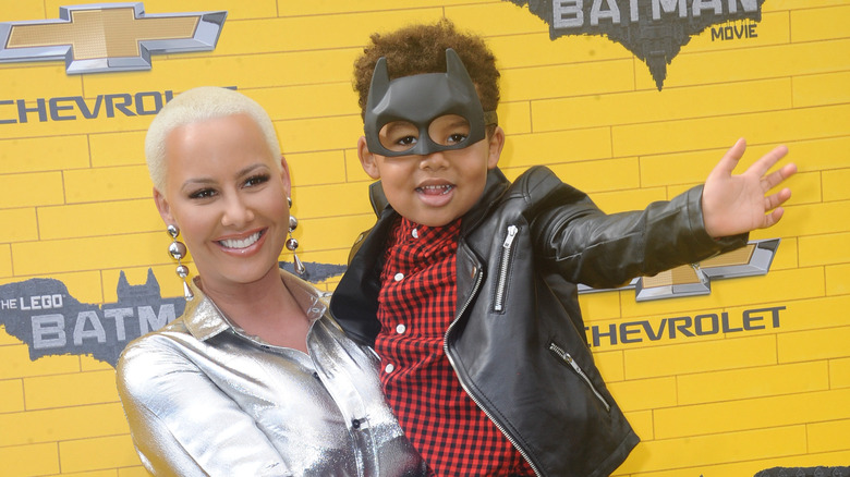 Amber Rose holding her son