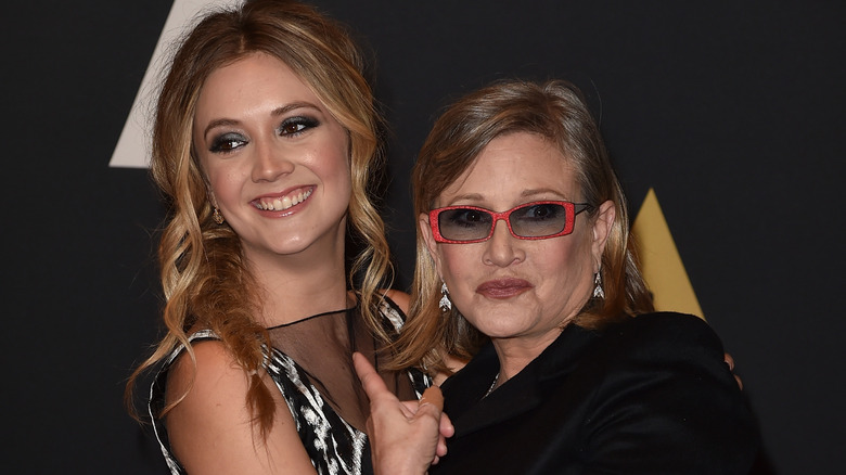 Billie Lourd smiling with Carrie Fisher on the red carpet