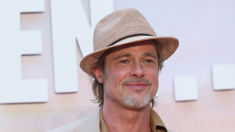 Brad Pitt in hat and coat 