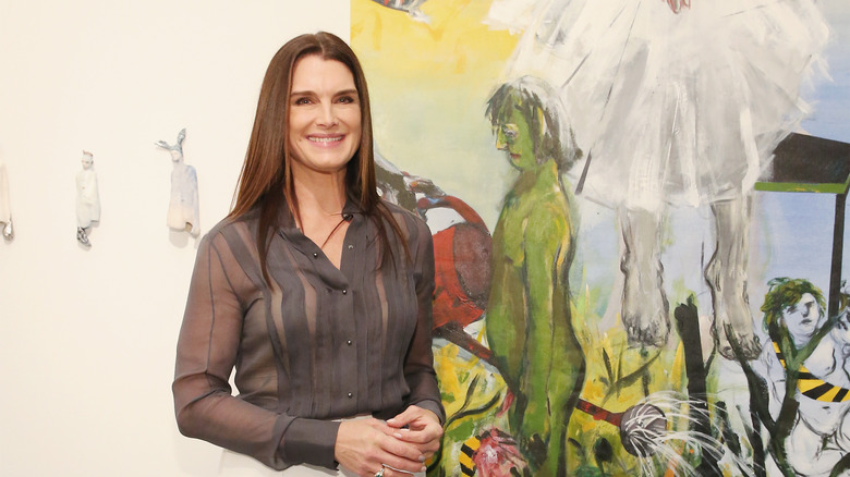 Brooke Shields posing by a painting