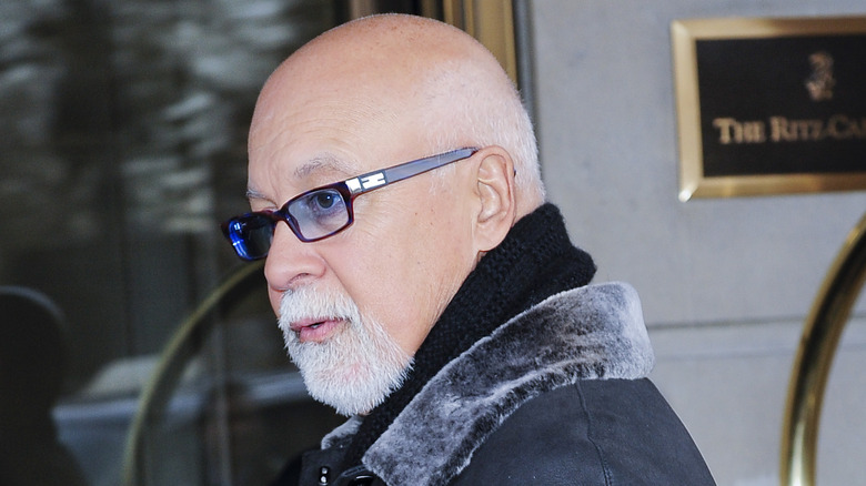 René Angélil wearing glasses