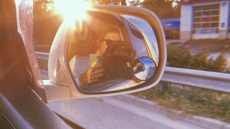 Chase Stokes taking a car selfie