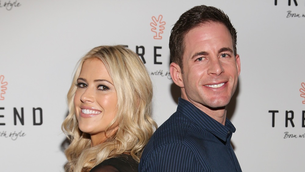 Christina Anstead and Tarek El Moussa standing back-to-back