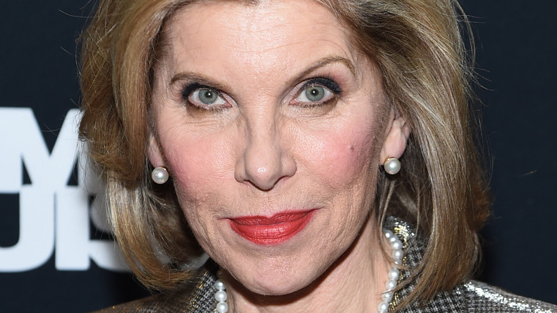 Christine Baranski posing, wearing pearls