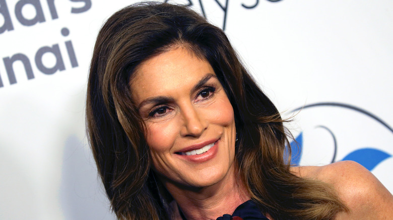 Cindy Crawford smiling at an event